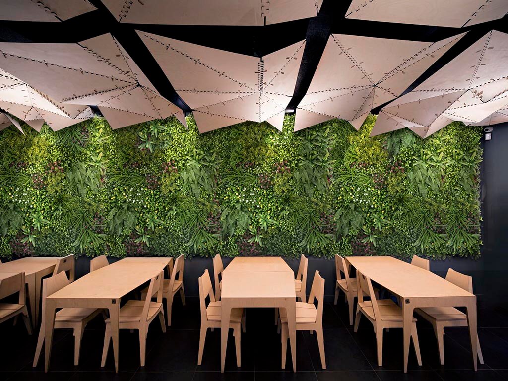 RESTAURANT SPACE TRANSFORMED BY FAUX GARDEN WALL 1 faux garden wall